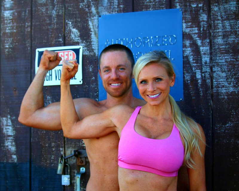 Sara & Ryan flexing right arms